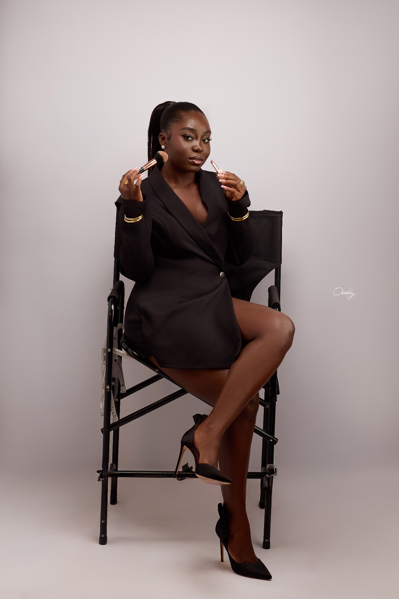 Nhyira Maison with makeup brush and lipstick